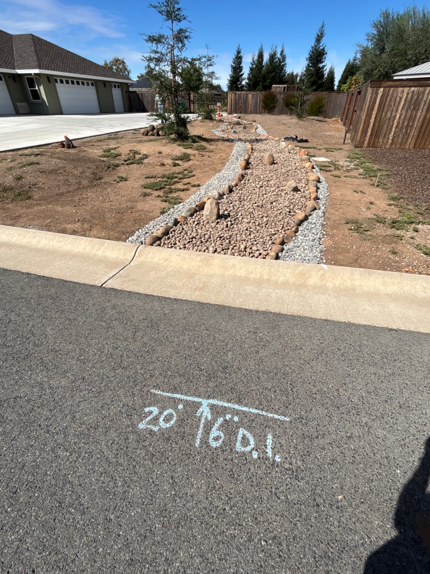 Rock-lined drainage channel handling slope runoff in Magalia, CA